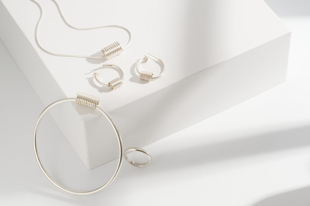 Sterling silver coil earrings, necklace and matching bangle and sterling silver textured ring