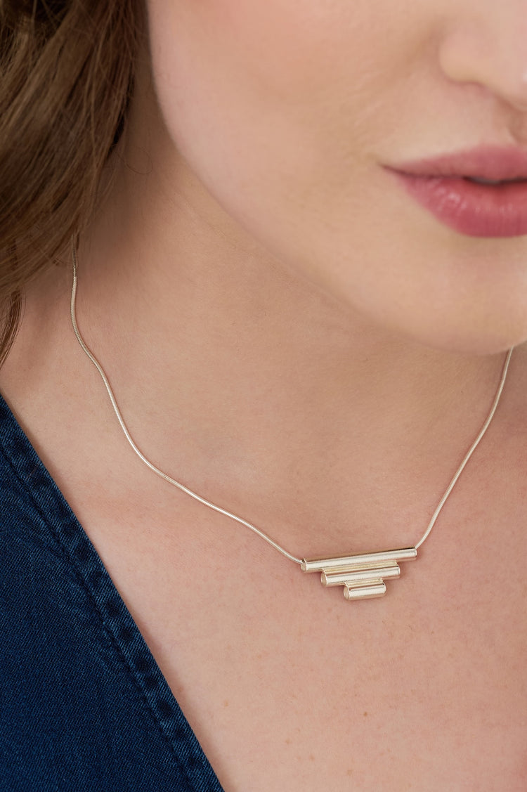 Sterling silver tube necklace with a 3cm, 2cm and 1cm tube joined together in descending size order and worn on a silver 40cm chain 