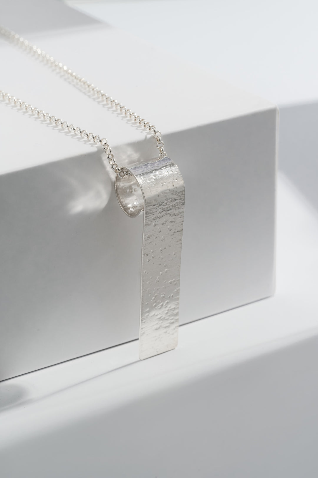 Sterling silver long textured pendant