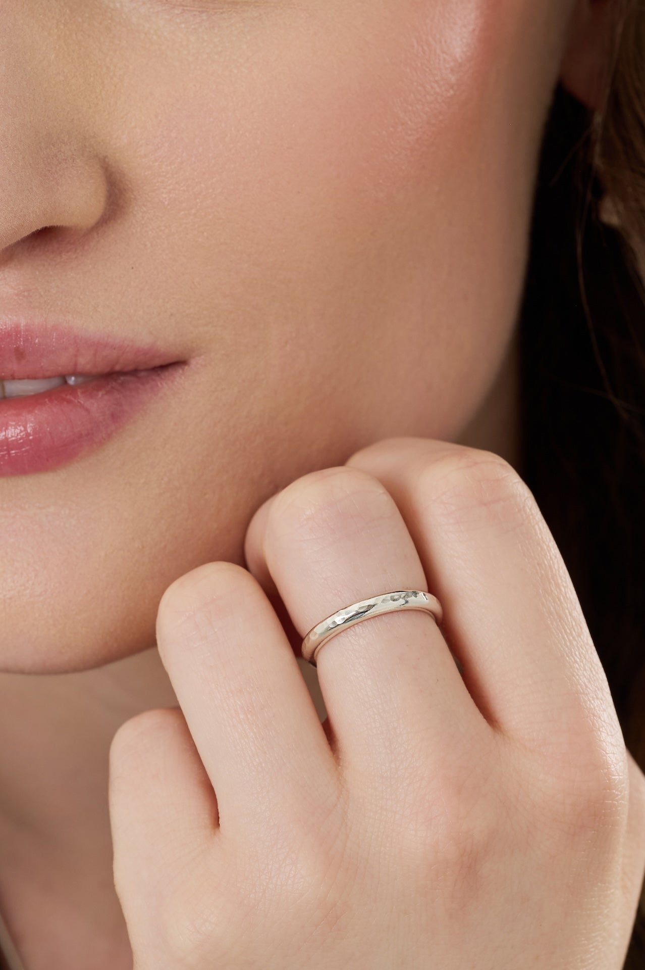 Sterling silver textured stacking ring worn in a close-up photo showing the texture on the ring